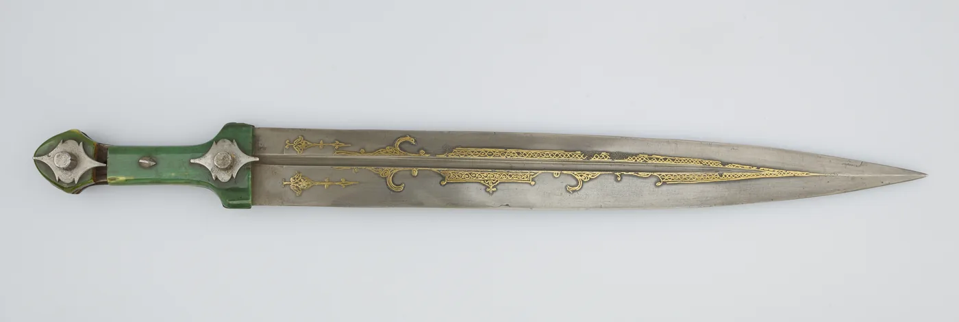 A Circassian kama dagger from 1750 to 1850 with a green hilt and a straight double-edged blade