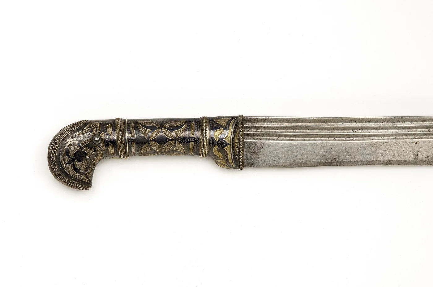 The hilt of a Circassian shashka dated 1829, covered in silver with gilding and black niello inlay