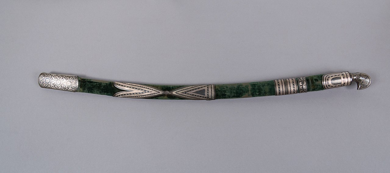 Circassian shashka sword with ornate silver-mounted scabbard
